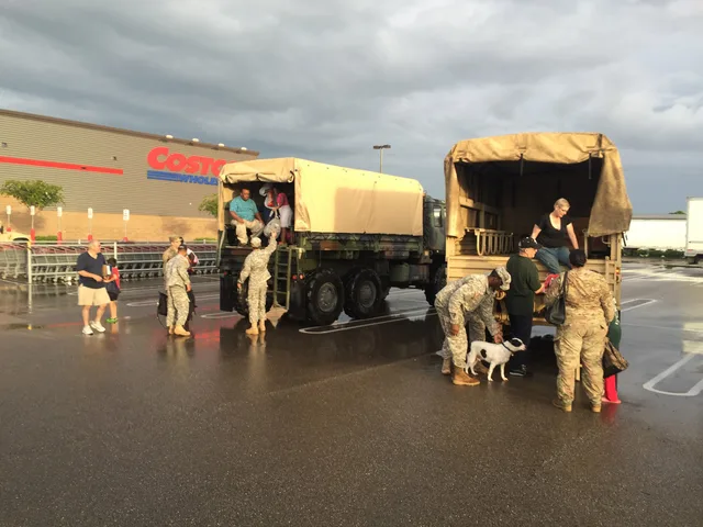 Louisiana National Guard Soldiers help citizens out of the back of a high-water vehicle on Airline Road in Baton Rouge, Louisiana after being rescued on Millerville, Aug. 14, 2016. (U.S. Army National Guard by 1st Lt. Gomez). Hurricane season courier backup routes: Gulf Coast storm plans
