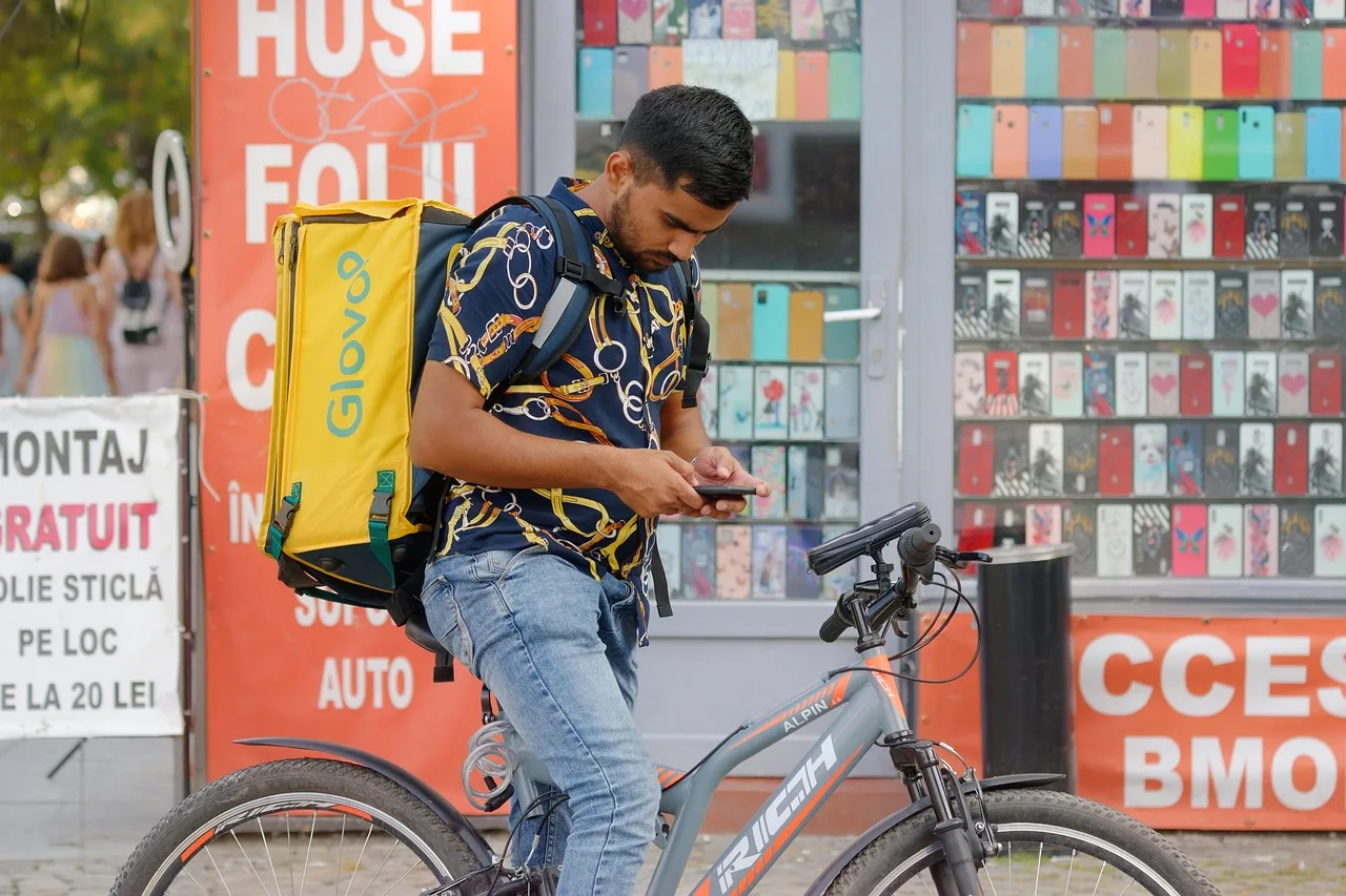 man, bicyclist, courier, bike, casual, backbox, looking, smartphone, application, courier, courier, courier, courier, courier. How IRS Schedule C and 1099-NEC rules shape US courier pay