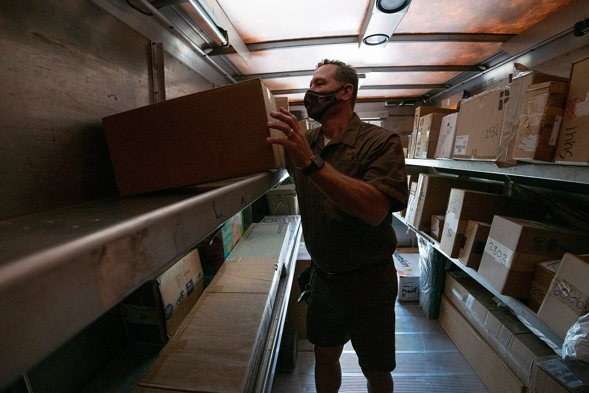 UPS Driver Wes Korczyncski delivers a food box from the U.S. Department of Agriculture (USDA) Food and Nutrition Service (FNS) Meals to You program that responded to the school closures due to COVID-19, here one of the partners, PepsiCo, implemented a logistics solution that utilizes package deliver. Local delivery employee pay structures explained