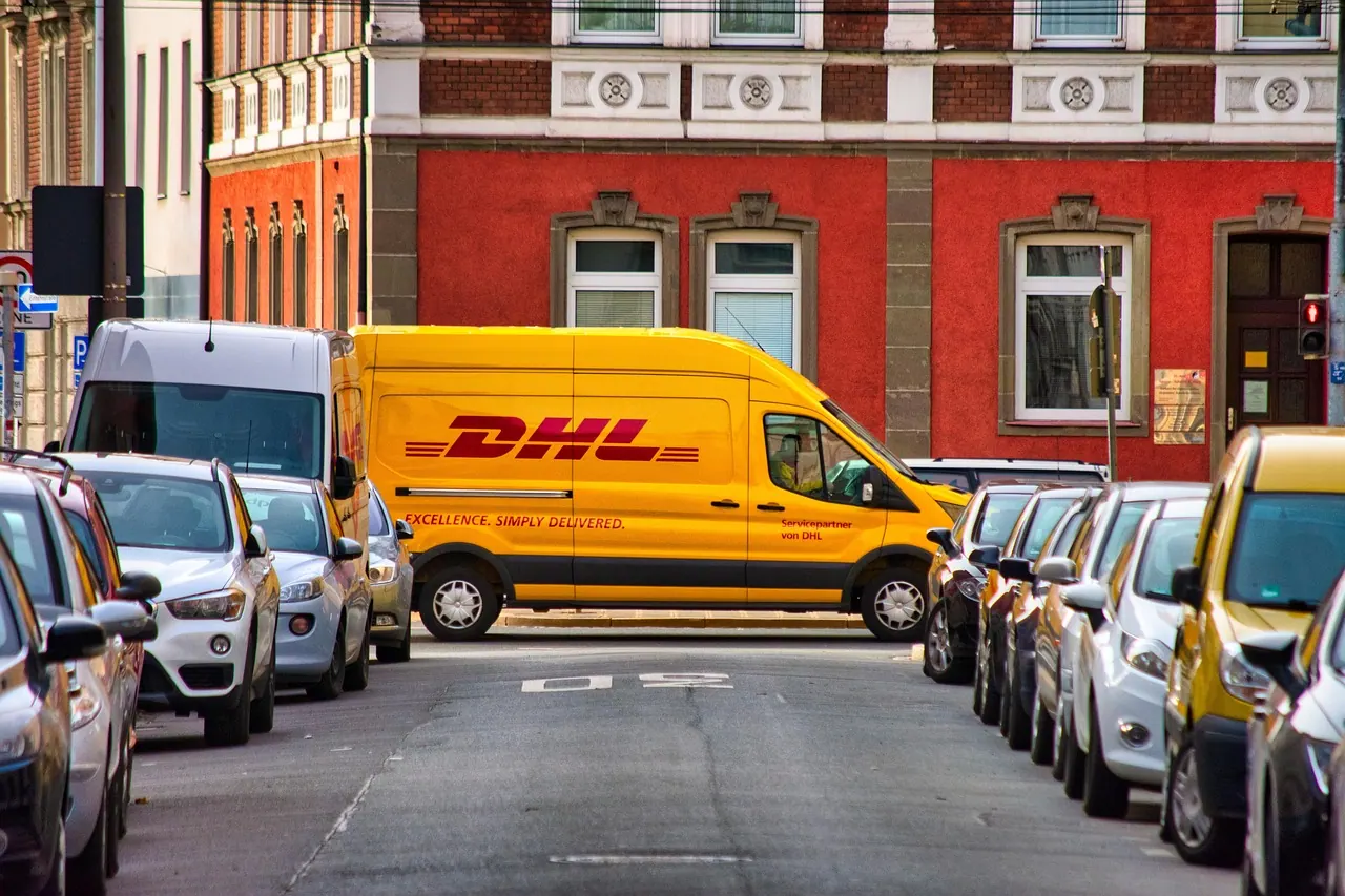 dhl, delivery, cars, street, parked cars, package delivery, parcel service, parcel delivery, van, delivery van, vehicles, transportation, courier, courier service, courier delivery. Local delivery profit margins and break-even points