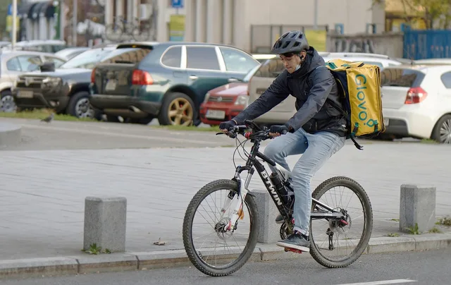 bicyclist, boy, courier, transport, urban, box, street, cars, courier, courier, courier, courier, courier. Pricing a second zone in a local delivery proposal
