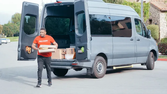 Courier in a delivery van distributing packages in a suburban setting. Local delivery sales: how to sell a workable route